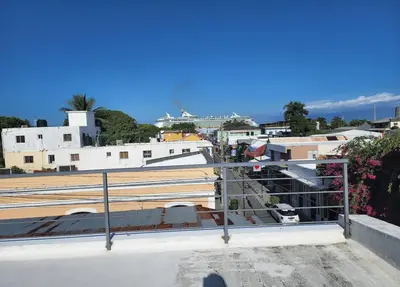 a view of a city from the roof of a building at Umbrella Street, city Center, close to many atracctions in San Felipe de Puerto Plata