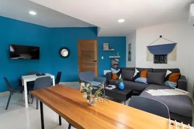 a living room with a couch and a table at LANDA MAR BOCA CHICA in Boca Chica