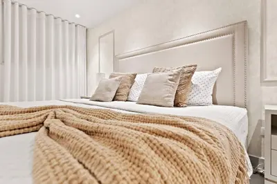 a bedroom with two beds with a blanket on it at Oasis Urbano Family 2br Pool Gym Lm22-8B in Santo Domingo