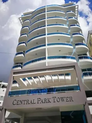a large white building with a central park tower at Stylish 1br Apt in Piantini/Serralles, Santo Dgo in Santo Domingo