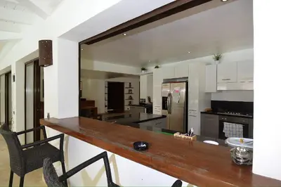 a kitchen with a wooden counter in a room at Seaside villa with housekeeping staff - Las Terrenas in Las Terrenas