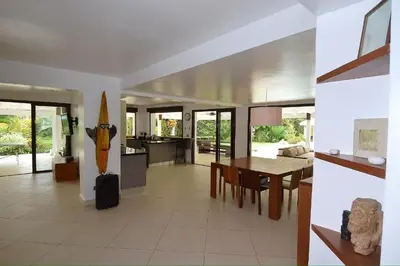 a living room with a table and a dining room at Seaside villa with housekeeping staff - Las Terrenas in Las Terrenas