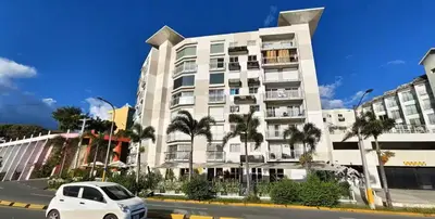 a white car parked in front of a building at Luxury Riviera Colonial, Santo Domingo in Santo Domingo