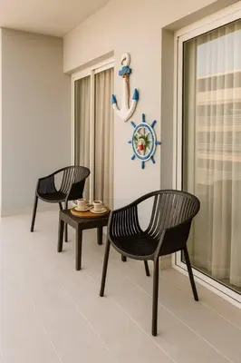 two chairs and a table in a room at Luxury Riviera Colonial, Santo Domingo in Santo Domingo