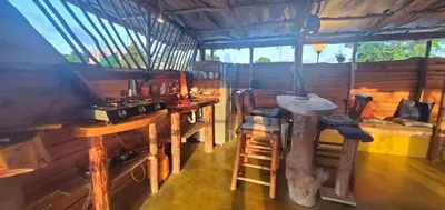 a kitchen with a stove and a counter in a room at Mini Lodge in Cabarete