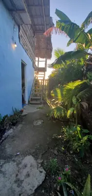 a patio of a house with a bunch of plants at Mini Lodge in Cabarete