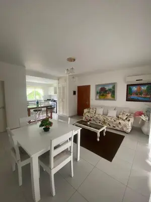 a living room with a table and a couch at Vista Golf II Bahia Principe Playa-Nueva Romana in San Pedro de Macorís