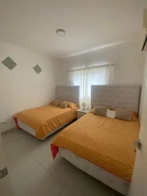a bedroom with two beds in a room at Vista Golf II Bahia Principe Playa-Nueva Romana in San Pedro de Macorís