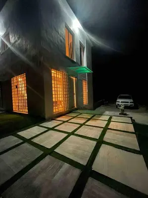 a car parked in front of a house at night at Casita Yanella in Cabrera