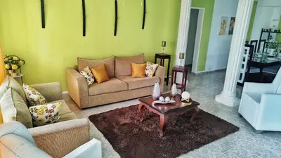 a living room with a couch and a coffee table at Camu in Camú
