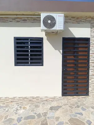 a window and a air conditioner on the side of a building at Apart Hotel Costa Verde#4 Exclusivo con cama Queen in Las Galeras