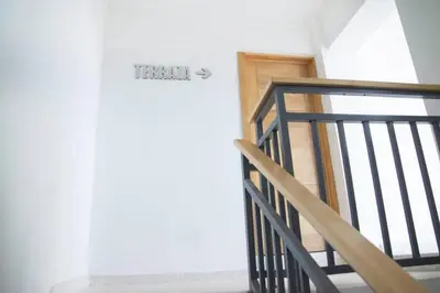 a staircase leading to a door in a room at Torre Sophia Monserrat in Los Frailes