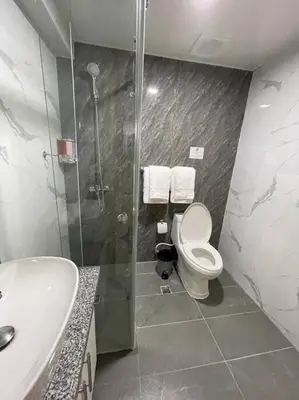 a bathroom with a shower and a toilet and a sink at Torre Sophia Monserrat in Los Frailes