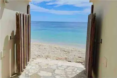 an open door to the beach with a view at Juan Dolio, Beach Access 2 BR Apt Salitre Tower front of Club Hemingway in Juan Dolio