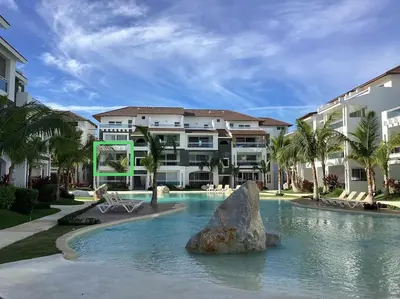 a resort with a pool with a rock in the water at Acogedor apartamento en Estrella Dominicus in La Laguna