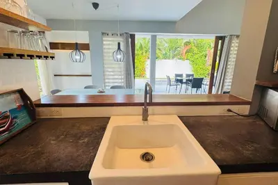 a kitchen with a sink and a view of a bedroom at Private Garden Villa With Parking in Las Terrenas