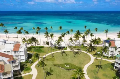 an aerial view of the beach and the ocean at beautiful beachfront complex with 2 pools, free wifi, free beach chairs in Punta Cana