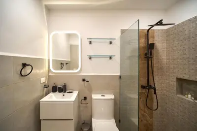 a bathroom with a toilet and a sink and a shower at Empyrean Tropical Wellness Portillo in Las Terrenas