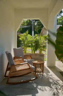 a living room with a couch and a table at Empyrean Tropical Wellness Portillo in Las Terrenas