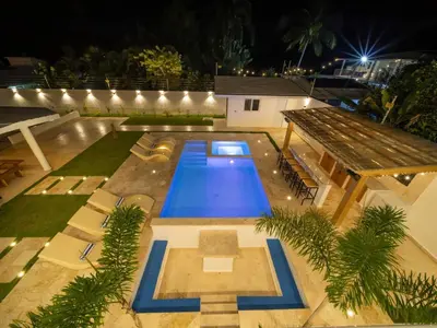 an overhead view of a swimming pool at night at Green Palace - 7br Luxury Villa in Sosua 3mins from strip plus 24hr security in Sosúa