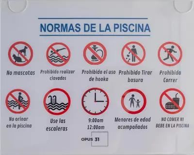 a sign in a foreign country with prohibited signs at Torre Opus 31 - Apto.605 in Santo Domingo