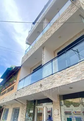an apartment building with a large glass balcony at RIG Puerto Malecón in Santo Domingo