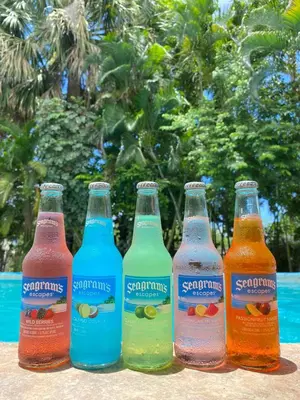 a group of six bottles of soda sitting on a table at Hotel Villa Marchena in Azua de Compostela