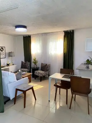 a living room with a couch and a table at Blessed house 
