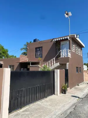 a house with a black fence in front of it at Blessed house 