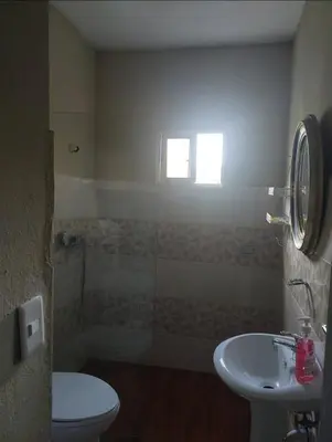 a bathroom with a shower and a toilet and a sink at New apartment close to everything in Santiago de los Caballeros