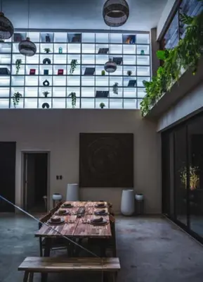 a large room with a table and a glass wall at Casa Ataraxia Modern Luxe Villa in Las Terrenas
