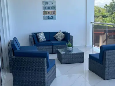 a living room with couches and a fire place at Luxury Beach Front Villa with Private pool and stunning Ocean View! in Punta Rucia