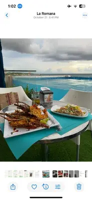 a table with two plates of food on it at A Caribbean-style rebirth, 2 minutes from the beach in La Romana
