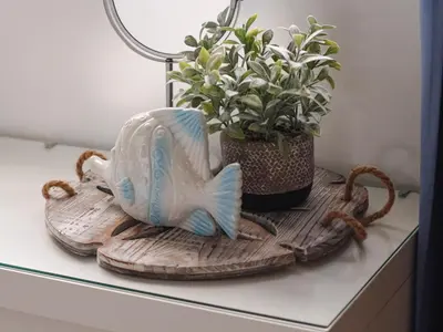 a wooden shelf with a fish and a plant on it at Apartamento de Ensueño en Las Terrenas Penthouse in Las Terrenas