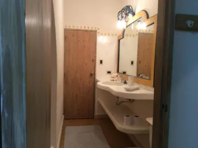 a bathroom with a sink and a mirror at Caraibidamari in Bayahibe
