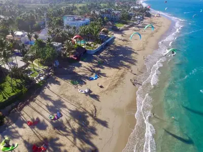 an aerial view of a beach with a water park at Mango House. Mono 2 bedrooms in Cabarete