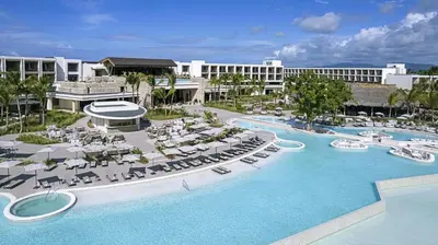 an aerial view of a resort with a swimming pool at Zemi Miches Punta Cana All-Inclusive Resort, Curio by Hilton in Miches