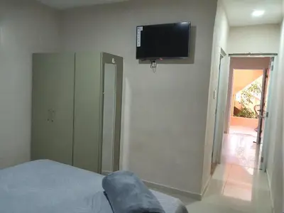 a bedroom with a flat screen tv on the wall at Villa rozenuda in El Higo