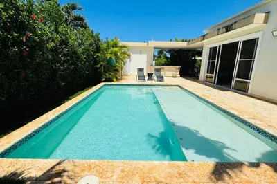 a swimming pool in front of a house at Casa Linda Villa 920 - Sosua in Sosúa