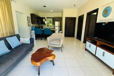 a living room with a couch and a table at Casa Linda Villa 920 - Sosua in Sosúa