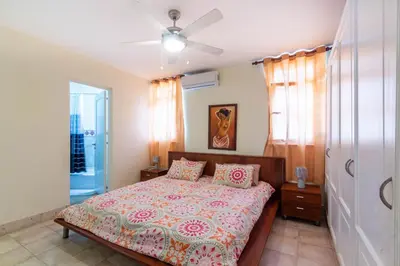 a bedroom with a bed and a ceiling fan at 