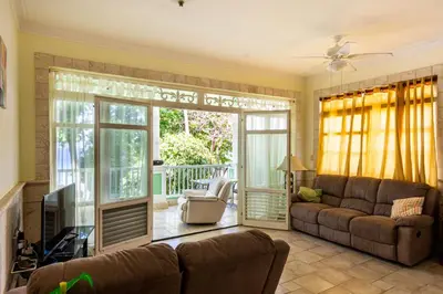 a living room with a couch and a sliding glass door at 