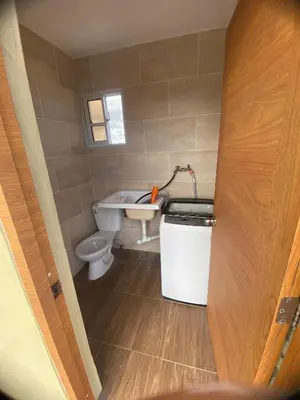 a small bathroom with a toilet and a sink at Estefany Aparment New in San Felipe de Puerto Plata