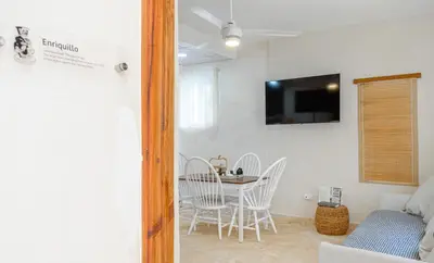 a small dining room with a table and chairs at Enriquillo 2-Bedroom Apt Casa Areito in Santo Domingo