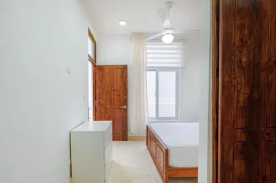 a bedroom with a bed and a window at Enriquillo 2-Bedroom Apt Casa Areito in Santo Domingo