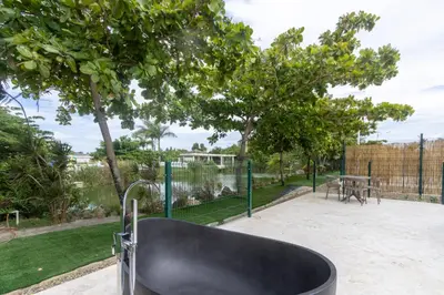 a black chair in front of a park with a table at Bubble Glamping Sosua! in Sosúa