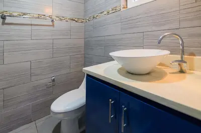 a bathroom with a sink and a toilet at Mango y Jobo - Relaxed Mountain & Sea Panoramic view - 10mins drive to beach and city in San Felipe de Puerto Plata