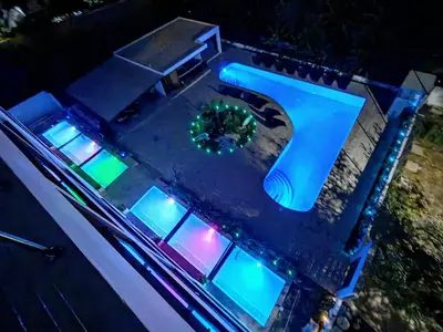 an overhead view of a house with blue lights at Surf One in Sosúa
