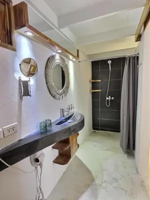 a bathroom with a sink and a shower at Leeloo Boutique Hotel in Las Terrenas