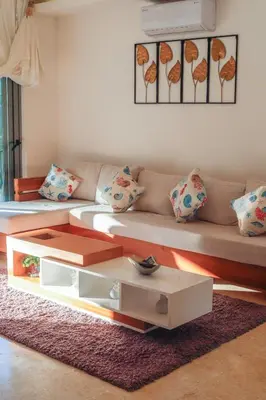a living room with a couch and a coffee table at Villa loren A3 in Las Terrenas